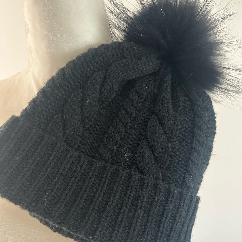 Black beanie with Pom Pom .